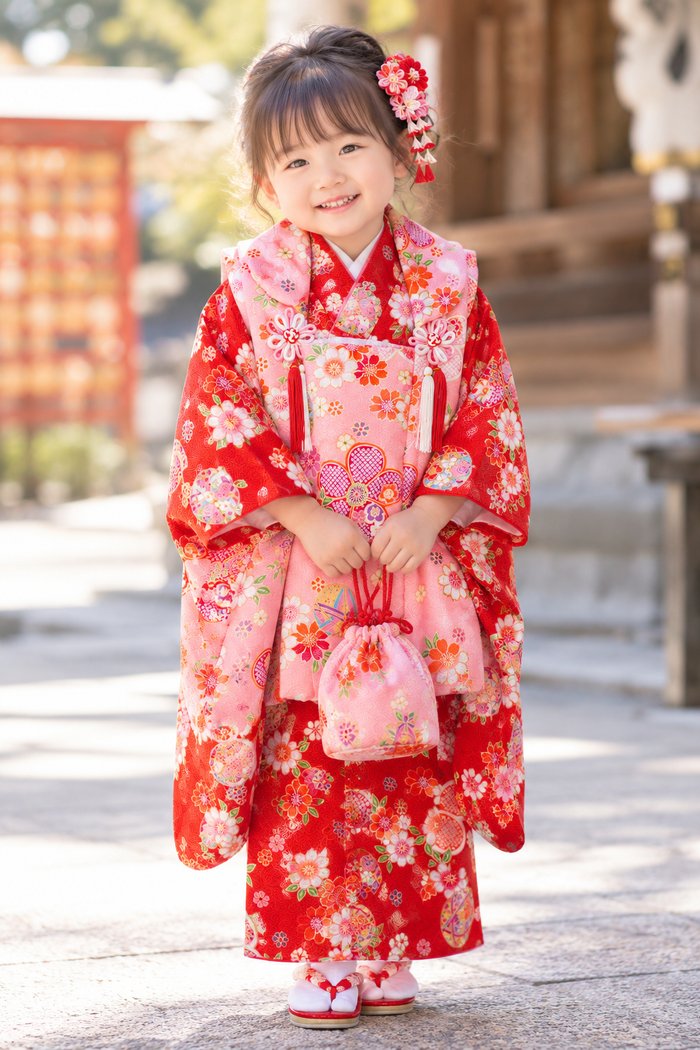 A 3-year-old girl in a gently colored hifu kimono